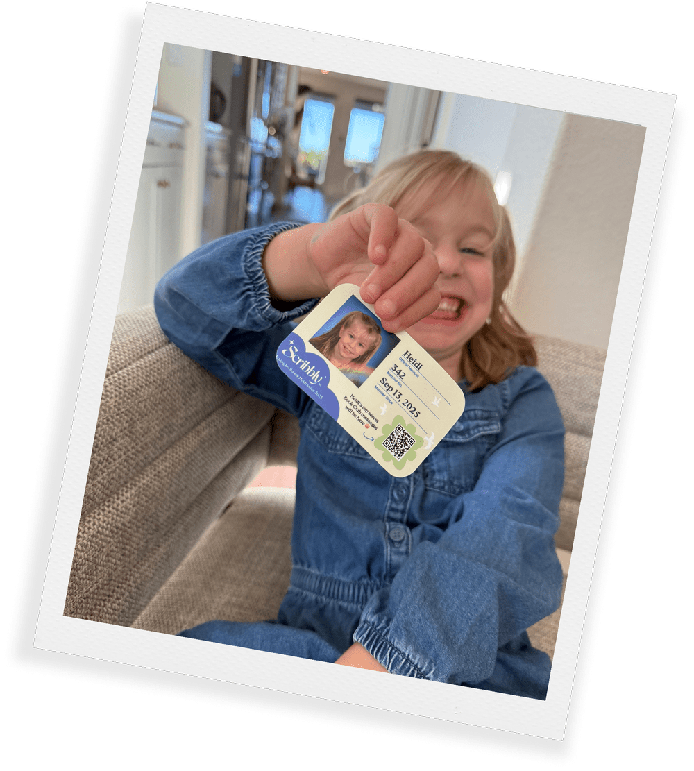 A delighted kid showing off their very own membership card